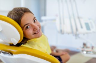 Smiling girl waiting for dental treatment dentist in Chapel Hill North Carolina