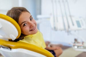 Smiling girl waiting for dental treatment dentist in Chapel Hill North Carolina